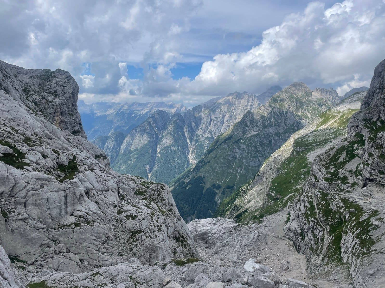 Rugged limestone mountain peaks and deep valleys of Mount Triglav in the Julian Alps.